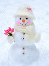 Festive Snowman Holding Flowers in Cozy Outdoor Winter Scene