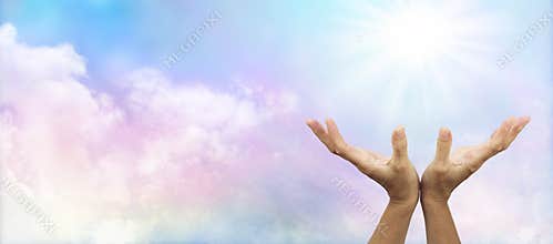 Healing Hands outstretched towards sun