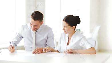 Man and woman signing a contract