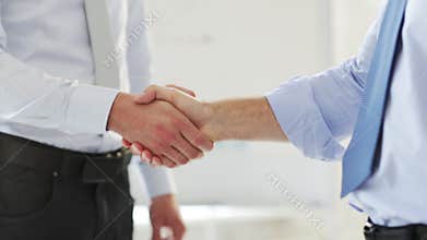 Two businessmen shaking their hands