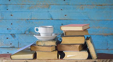 Old books and cup of coffee