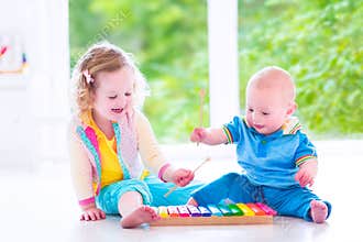 Kids playing music with xylophone
