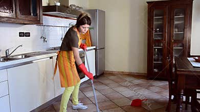 Happy housewife cleaning and dancing