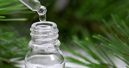 aromatherapy - essential oil dripping from pipette
