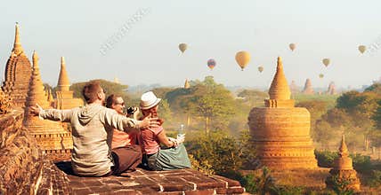Happy tourists, friends, vacationers in the summer holidays in Asia