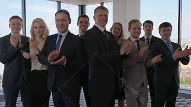 Business co-workers clapping