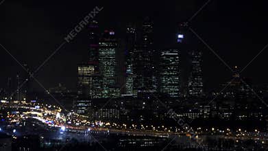 Moscow international business center `Moscow-cityÂ». Night or evening cityscape. Blue sky and street lights