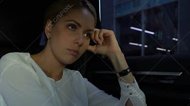 Overworked business woman closing car window, tired of all-day work, stress