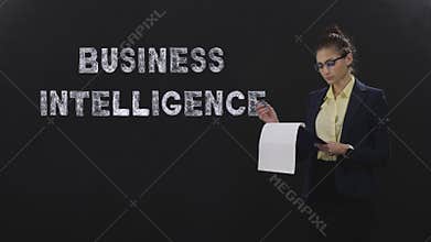 Lady with glasses and documents on black background, business intelligence