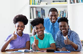 Portrait of male teacher with african american students