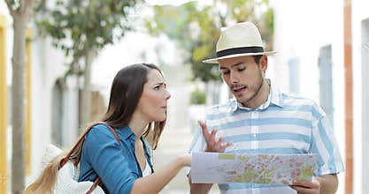 Angry couple of tourists arguing on vacation