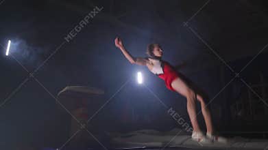 Gymnast gymnastic somersault exercise HD slow-motion video. Athlete salto