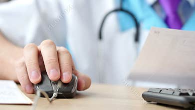 Medicine doctor working and using mouse on computer
