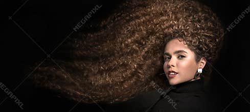 Mixed race black woman portrait with big afro hair, curly hair. Hair care concept