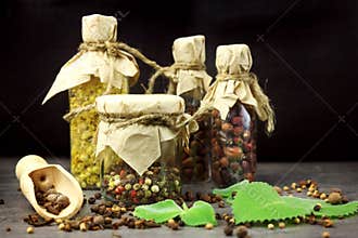 Tincture bottles, assortment of dry healthy herbs, old books, mortar, curative drugs. Herbal medicine.