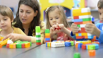 Kids and Educator Playing at Kindergarten