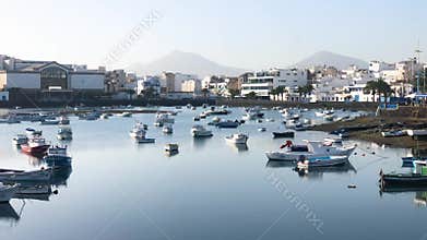 The lagoon of Charco de San Gines in Arrecife with a flotilla of small boats on a sunny afternoon, Lanzarote, Canary Islands,