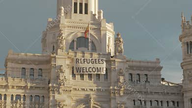 Cybele Palace with banner Refugees Welcome