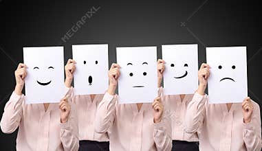 Five businesswoman holding a card with drawing facial expressions different emotion feelings face on white paper