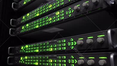 Data center server racks blinking LED green lights. Audio telecommunication racks