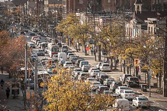 Traffic jam on College Street in Downtown Toronto, Ontario, Canada, made of cars and streetcars, during rush hour