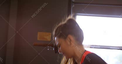 Woman exercising in a fitness studio 4k