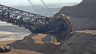 Bucket-wheel excavator in open-cast mining pit in Germany