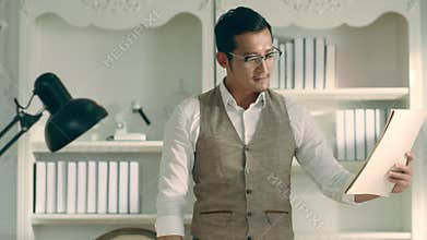 Asian architect finishes a sketch