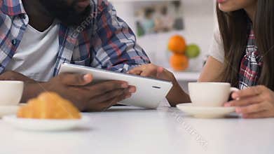 Family couple doing shopping online during breakfast, laptop app, delivery