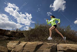 Athletic Woman Jumping While Running