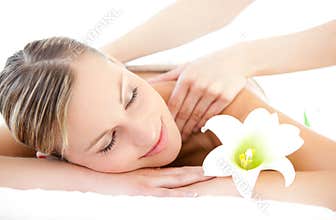 Relaxed woman receiving a back massage