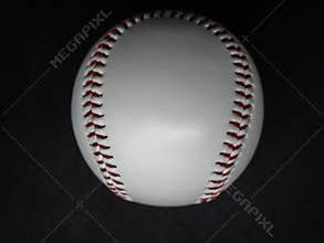Baseball ball with red threads on a dark background