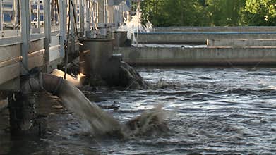 Dirty water squirt from pipes in waterworks treatment plant. Static shot