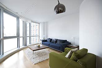 Modern living room with floor to ceiling windows
