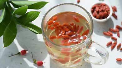 Goji berry tea in a glass cup