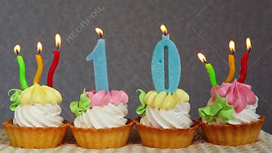 Happy 10 birthday cakes and blue candles