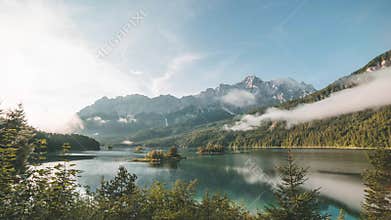 4K Time lapse of lake Eibsee in Bavaria Germany clouds during sunrise