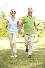 Mature couple walking in countryside