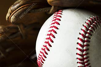 Closeup of baseball ball and gloves