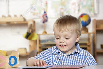 Young Boy Playing at Montessori/Pre-School