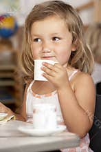 Young Girl Having Tea at Montessori/Pre-School