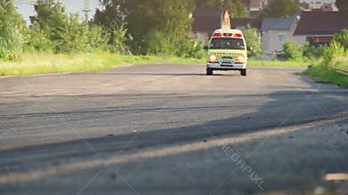 Ambulance car with siren on driving desert race track