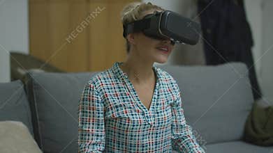 Cheerful woman in VR headset