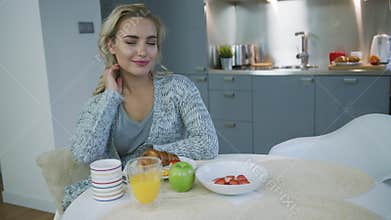 Woman dreaming during breakfast