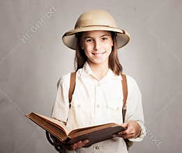 Little explorer reading a book