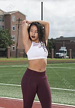 Stunning African-American fitness model on outdoor track