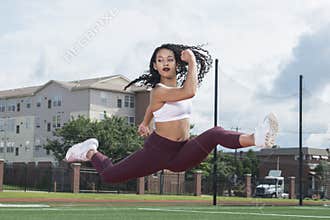 Stunning African-American fitness model on outdoor track