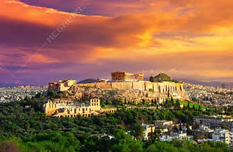 Acropolis with Parthenon. View through a frame with green plants, trees, ancient marbles and cityscape, Athens.