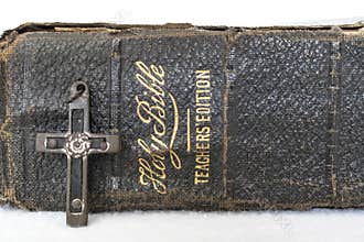 Antique Worn Leather Bible with Antique Wood and Metal Cross on