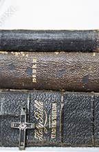 Trio of Worn Antique Leather Bibles with Antique Cross in Wood a
